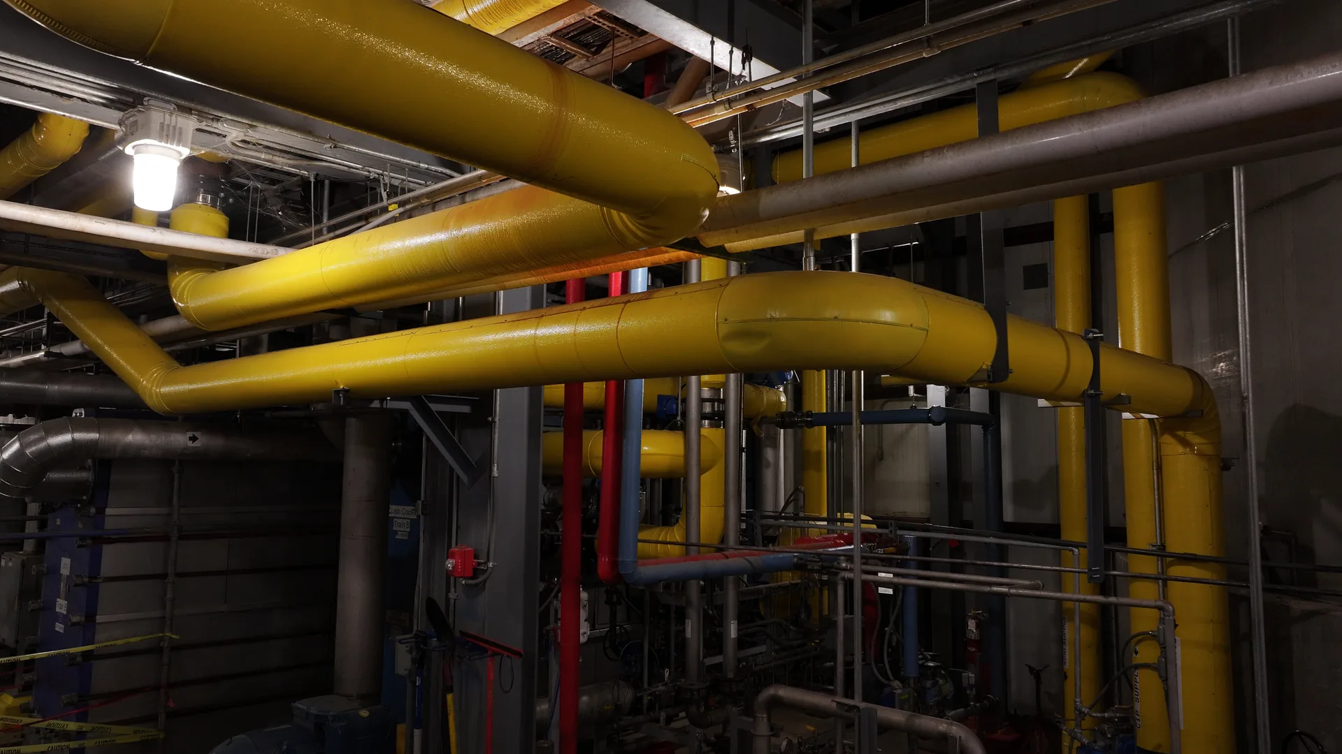 Insulated piping system inside industrial facility
