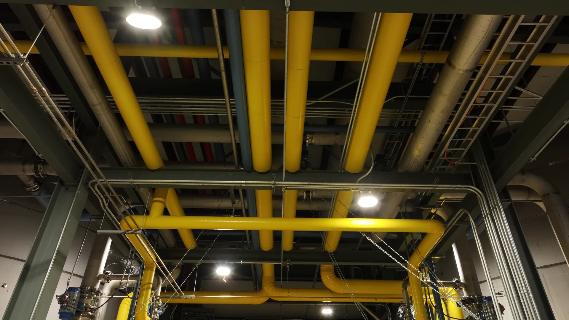 Overhead view of insulated yellow process piping